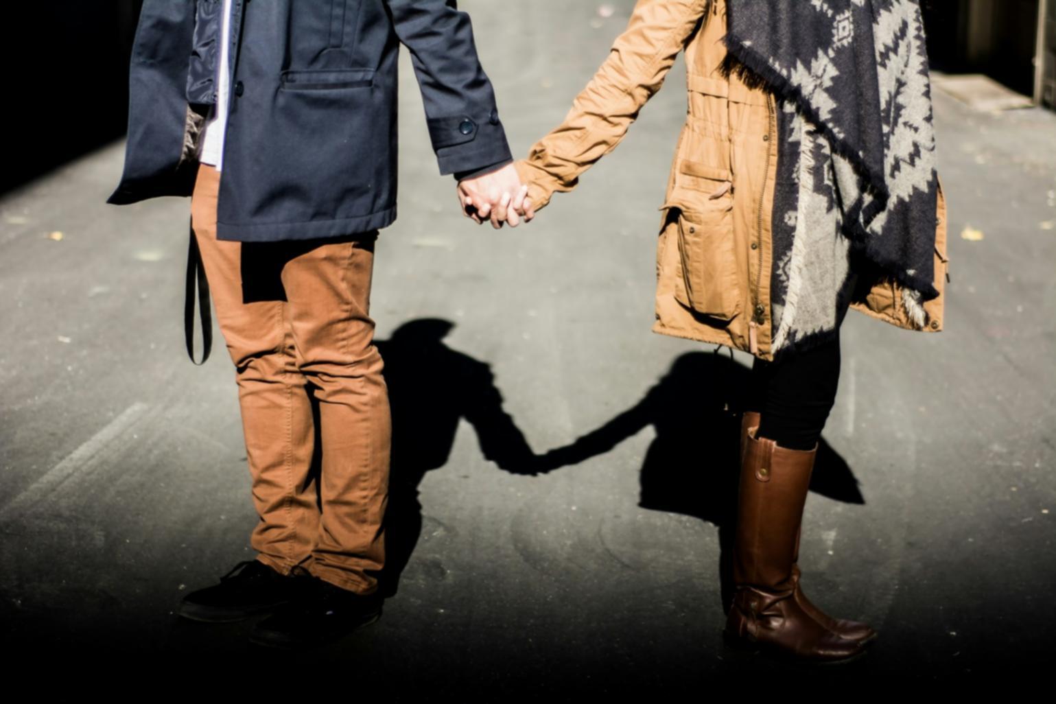 Care provider assisting elderly individual with daily activities in home setting