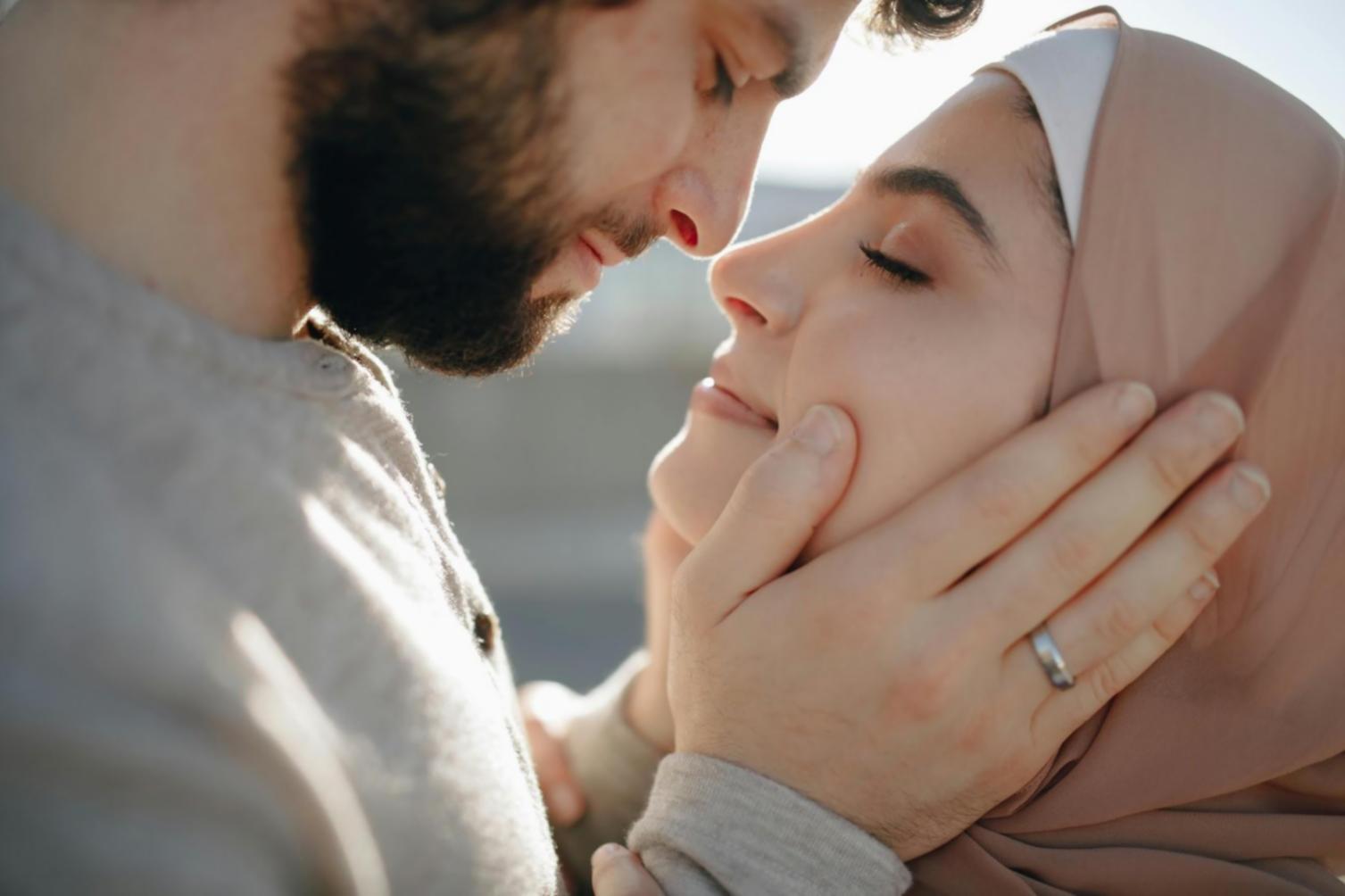 Attentive care professional assisting elderly individual with daily activities in supportive home environment