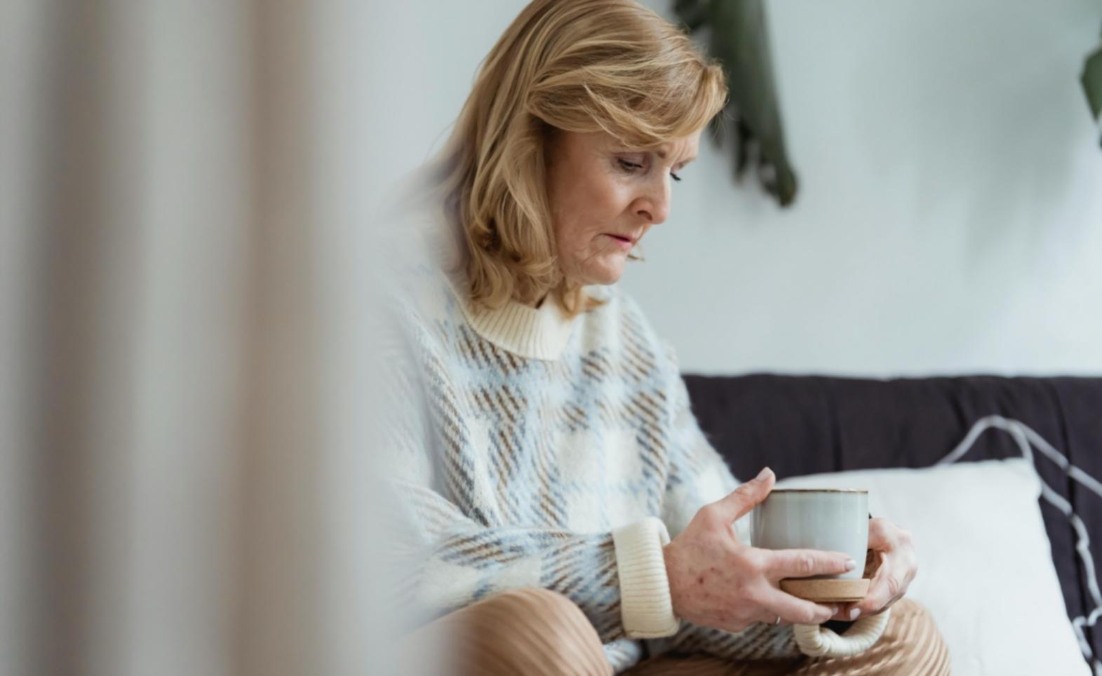 Care coordinator discussing personalized support plan with client and family in comfortable home setting