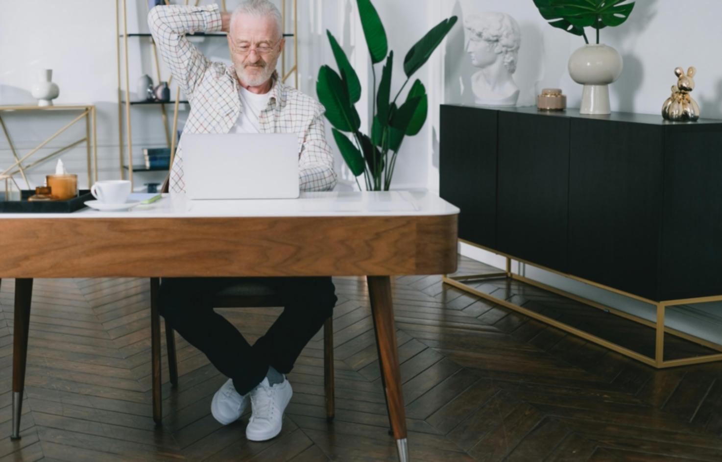 Professional care team member assisting elderly person during outdoor walking session