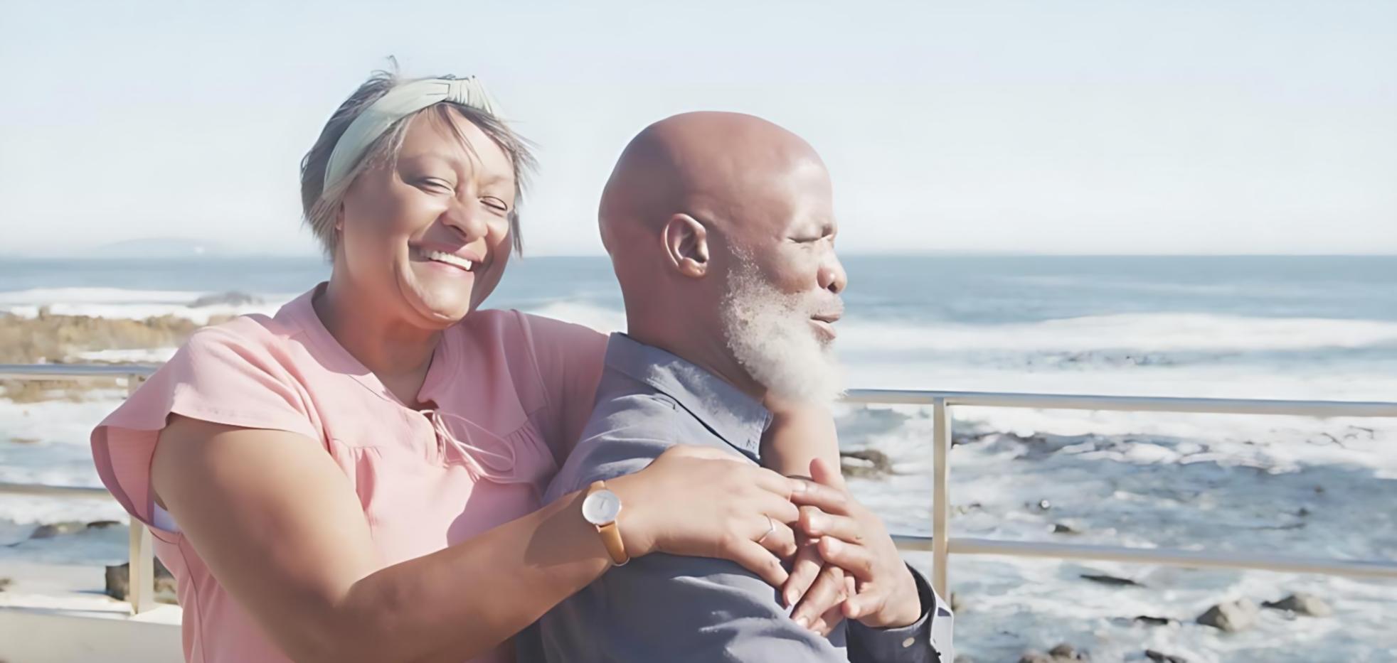 Caregiver assisting elderly person with daily activities in comfortable home environment